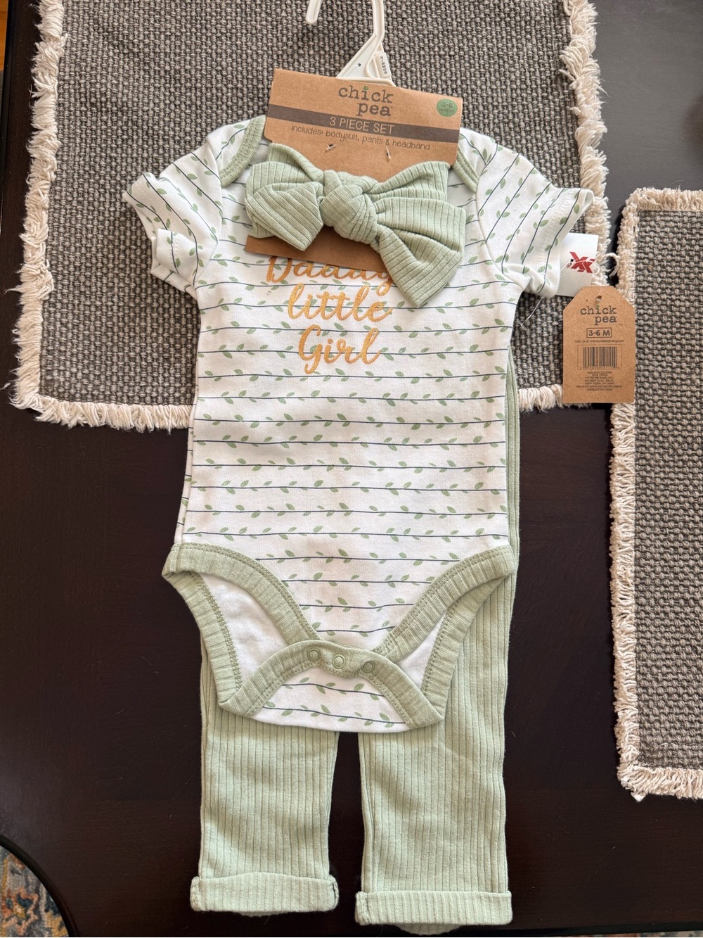 chick pea sage green and white baby one-piece set with gold text